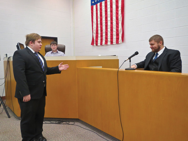 Students prepare for a scrimmage with Creighton University at Guthrie County Courthouse.