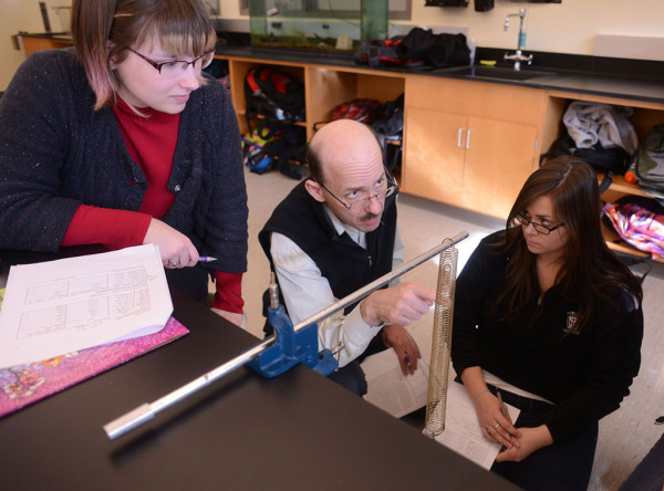Viktor Martisovitz, associate professor of physics, explains the principles of physics laws.