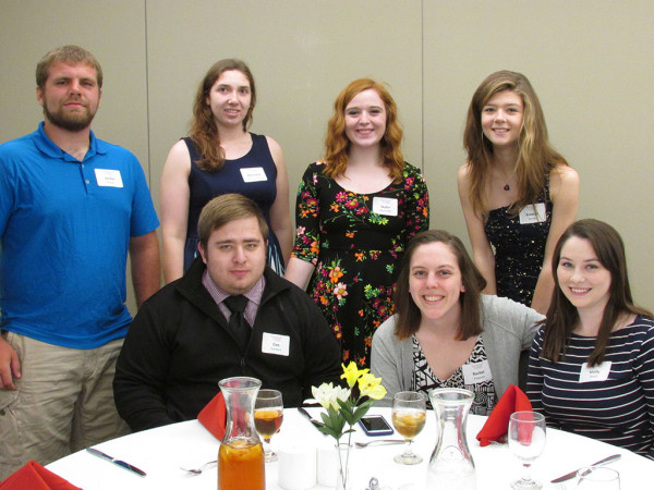 Rev. Ellen Nolte Racheter, Don Racheter, John Fisher '87 and Bill Northup '83 celebrated 30 years of Central mock trial.