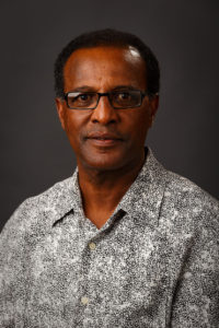 Debela Birru, associate professor of business management, retires after 27 years at Central College.