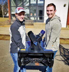 Challen and McCleary carry the Ankle Biter outside before demonstrating it to Central’s senior leadership team.
