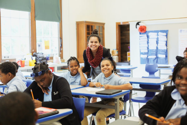Mendez and a pair of her students in the classroom.